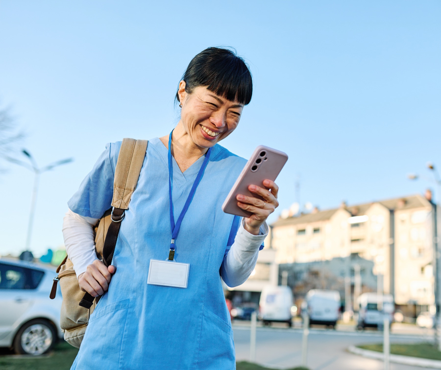 caregiver checking phone between visits, confident
